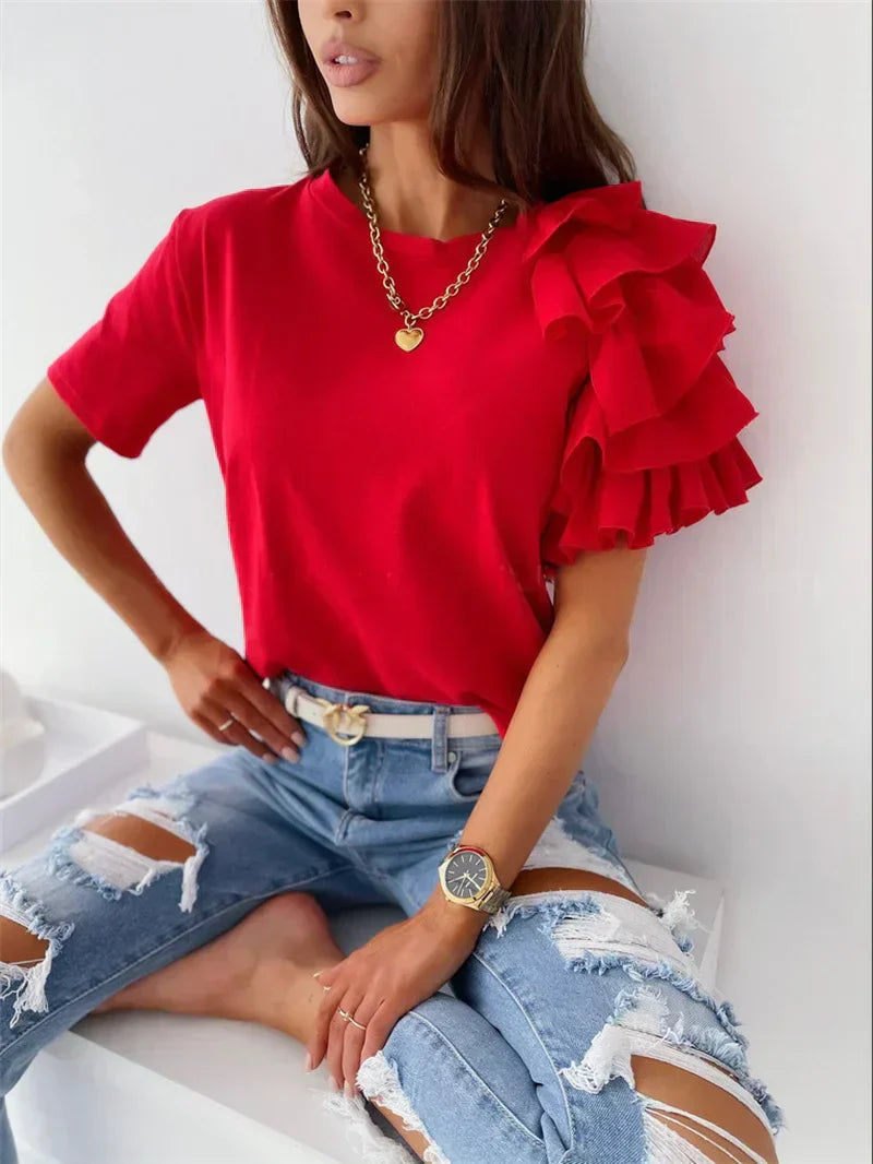 Anna™ | Trendy top met statement rufflemouw